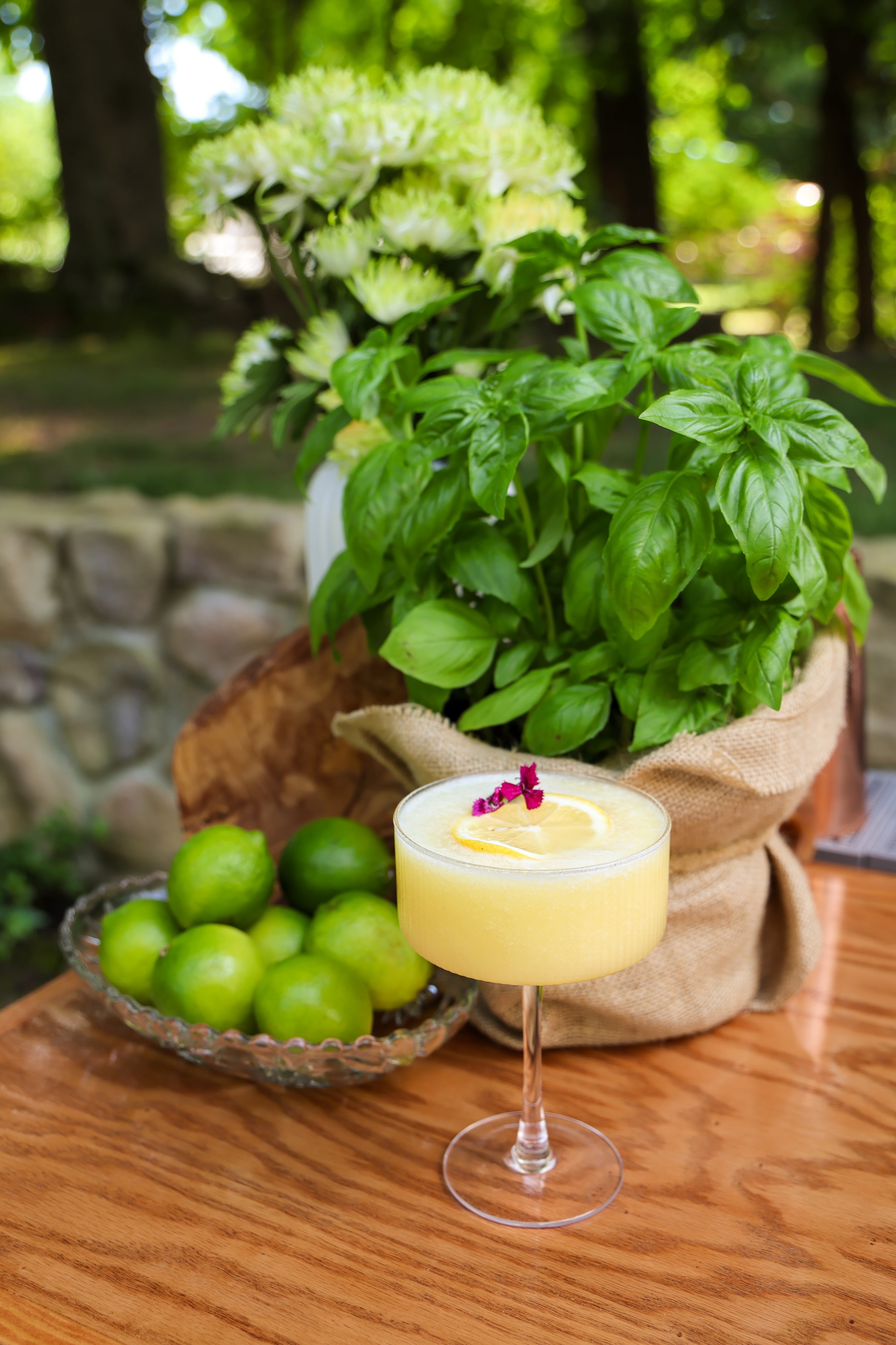 Fresh basil cocktail with lime garnish