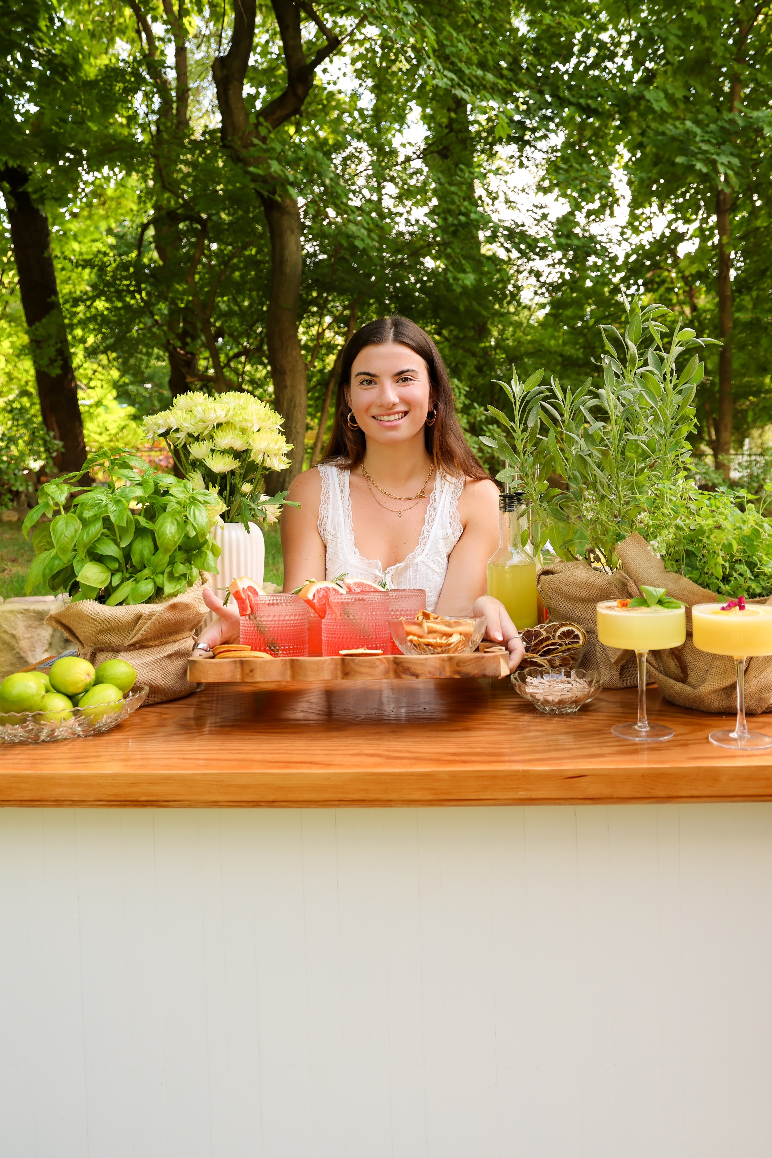 Woman hosting outdoor garden party table